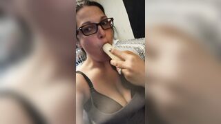 Candy licking and blowing a banana