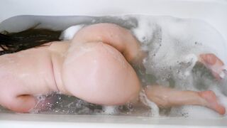 Big Boobed chick masturbates inside the restroom