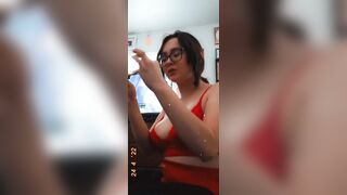 Point Of View of MILF eating wings with hooters out