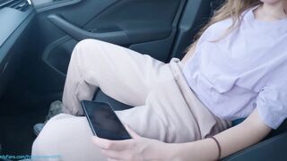 Teenagers masturbates on a outdoor vehicle park watching her porn