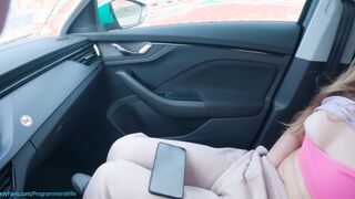 Teenagers masturbates on a outdoor vehicle park watching her porn