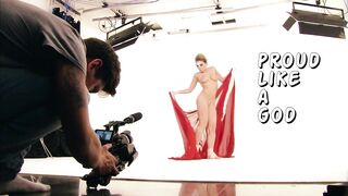 real photosession of naked baby with only red sheet on her body