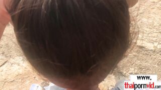 Thai teen giving a blowjob at the beach