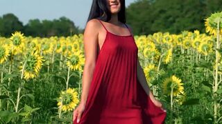 Asian teen posing in sunfolower field