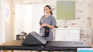 Brunette masseuse gives a finger massage with a bolster