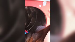teenagers blows his coach on a slide among people