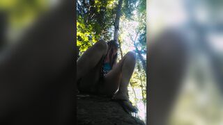 casually peeing on a rock into outside