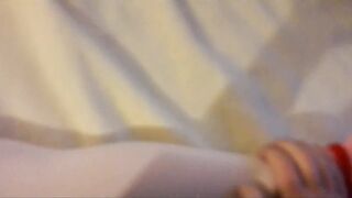 Laura is wearing a hot white dress, pink stockings and platform heels, bound up and gagged into a bed