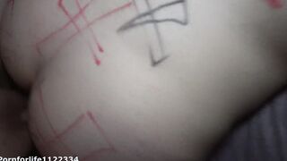 Obsessed chick bound to the bed getting exorcism by the priest Halloween