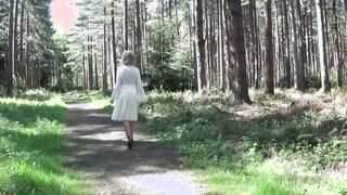 Big Tit housewife stripping into the woods
