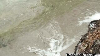 Mature blonde grandmother takes it from both sides outdoor
