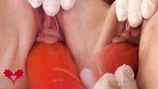Close up cunt play with the huge red vibrator.