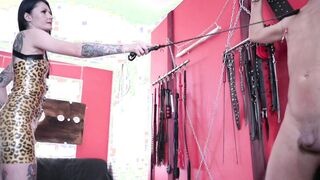 Domina Nika scratches the body of a sub, plays with his nipples. bondage