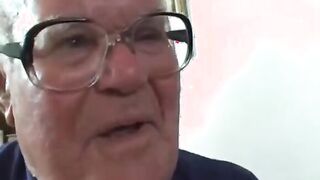 Slut demonstrates dildo to old man