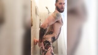 Tatted Hunk Fucks Dildo in Shower Until He Cums