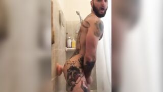 Tatted Hunk Fucks Dildo in Shower Until He Cums