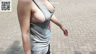 In a t-shirt and without a bra in the park