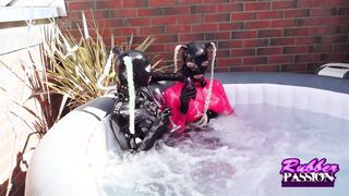 Lesbo Pvc Couple Play inside the Hottie bath tub