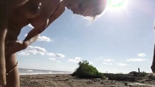 Blonde slut sucks old guys dick on the beach in Florida