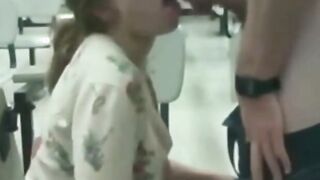 Naughty blonde girl sucks dick at a public place