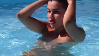 Naked French beauty posing by the pool