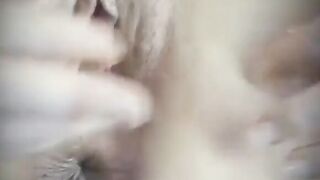 a cute blonde spreads her pussy for us