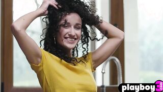 Petite curly teen posed in the kitchen