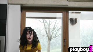 Petite curly teen posed in the kitchen