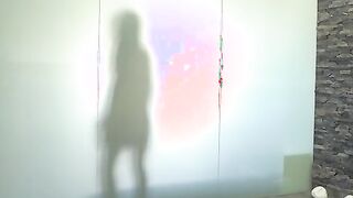Alexis Brill hoses herself off in the pool shower before carefully stepping to the changing room where she puts on