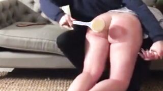 Spanking of Natasja's big ass with a laddle