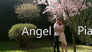 Angel Piaff and Lutro enjoy a sweet moment outdoor beneath the blossoms of a cherry tree. Their laughter turns to