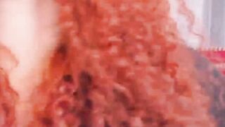 Curly Redhead Shaking While Rubbing Her Pussy