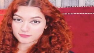 Curly Redhead Shaking While Rubbing Her Pussy