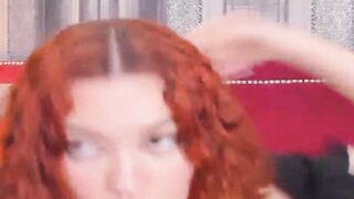 Curly Redhead Shaking While Rubbing Her Pussy