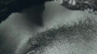 A finger in her tight butt while she rubs her bushy pussy
