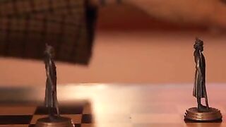 Silvia Nubi and Gabe Tonic are locked inside a battle of wits as they challenge each other in chess. To