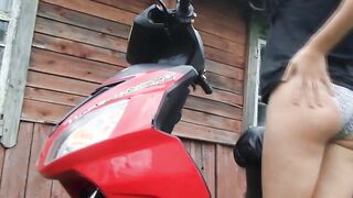 Biker bimbos masturbates on her red motorcycle