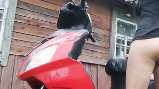 Biker bimbos masturbates on her red motorcycle
