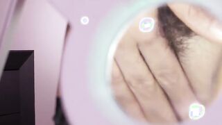 Gigantic-tits goddess studies her unshaved twat with a magnifying glass