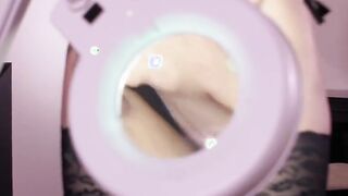 Gigantic-tits goddess studies her unshaved twat with a magnifying glass