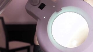 Gigantic-tits goddess studies her unshaved twat with a magnifying glass