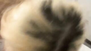 Blonde hairdresser blows on a huge meat pole