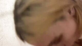 Blonde hairdresser blows on a huge meat pole
