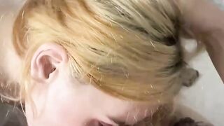 Blonde hairdresser blows on a huge meat pole
