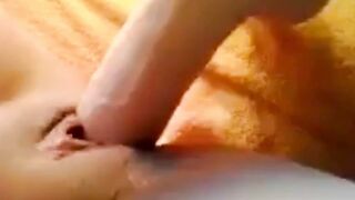 slurping pussy engulfs a big dildo
