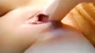slurping pussy engulfs a big dildo
