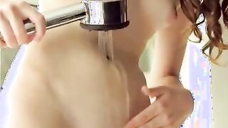 While Alice Marche waits for her bathtub to fill with warm water, she takes her