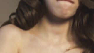 Stunning dark haired's big natural melons bounce as she masturbates