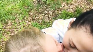 Two Girlfriends Suck Cock in the Wood