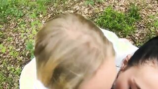 Two Girlfriends Suck Cock in the Wood